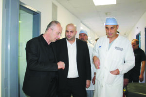 Minister of Health Dr. Nasseredine tours with Dr. Darwiche (right), whose patients had surgeries at the hospital in Baalbeck.