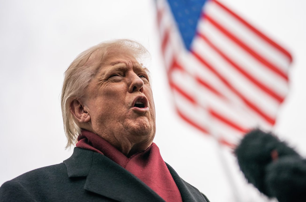 President Donald Trump speaks to the press Saturday at the White House.