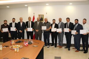 Medical mission team members receive certificates of appreciation from the Lebanese Minister of Public Health at the end of the mission.