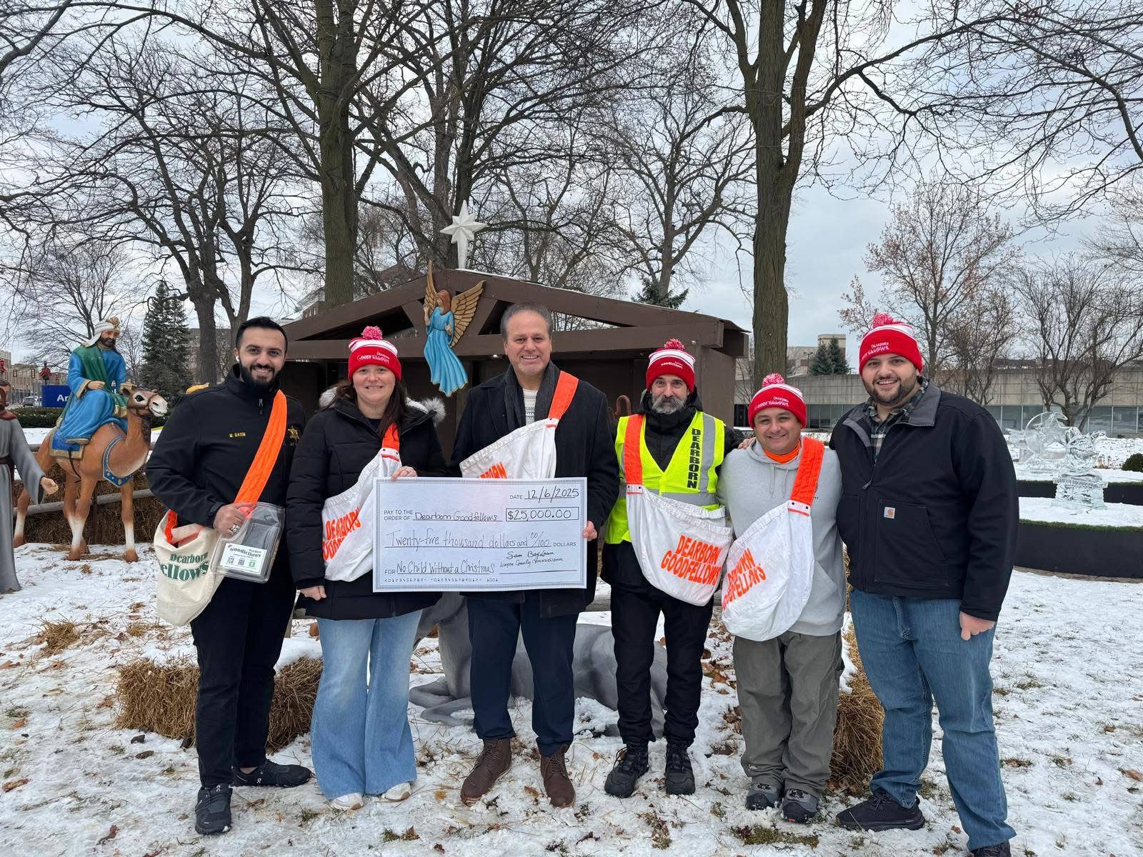 Wayne County Commissioner Sam Baydoun presnts the check to members of the Dearborn Goodfellows joined by State Rep Alabas Farhat, Silvio Davis. – Photo a courtesy of Commissioner Sam Baydoun