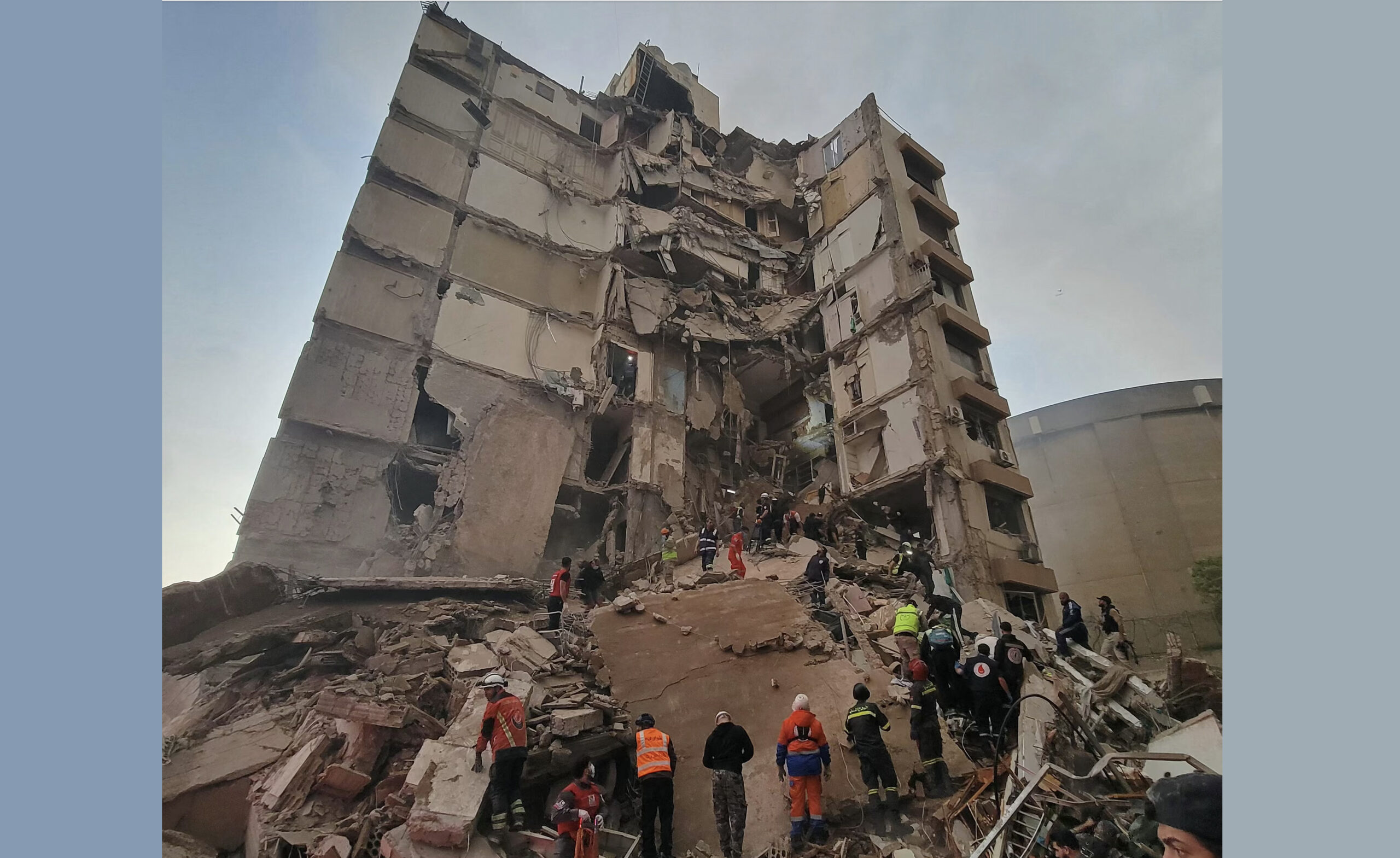 First responders and residents gather at the site of an Israeli airstrike in Beirut’s Tallet Al-khayyat neighborhood. - Photo by AFP