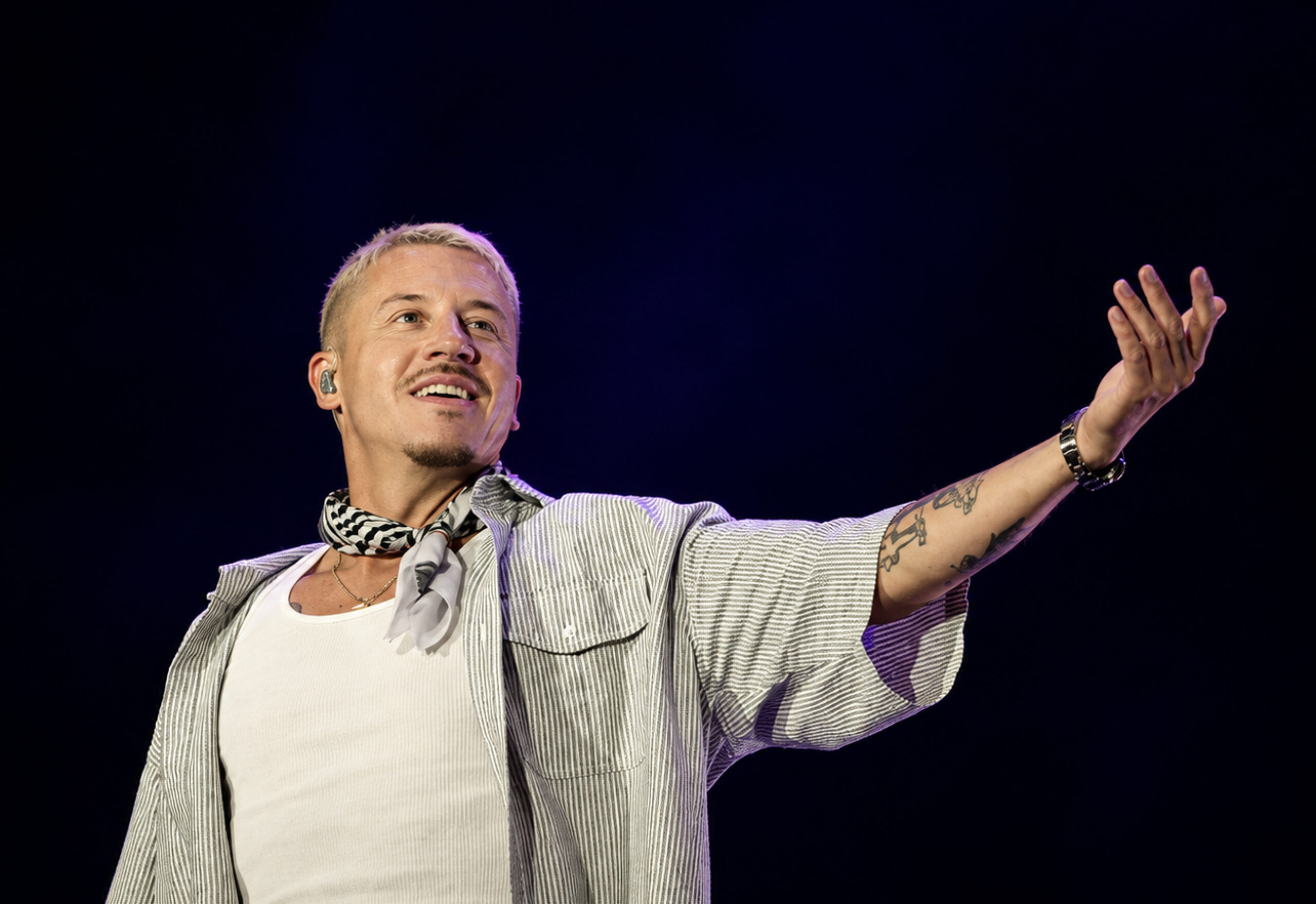 Macklemore’s removal over “Free Palestine” remarks sparks artist revolt